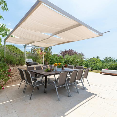 Gather over alfresco dinners on the shaded terrace