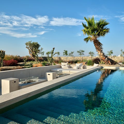 Enjoy the pool by day, and the firepit by night