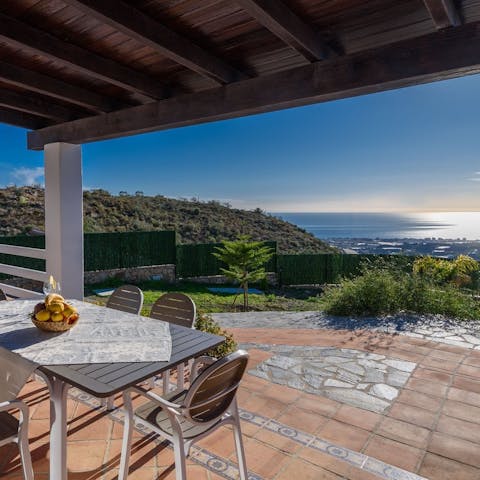 Enjoy an alfresco meal with stunning sea views