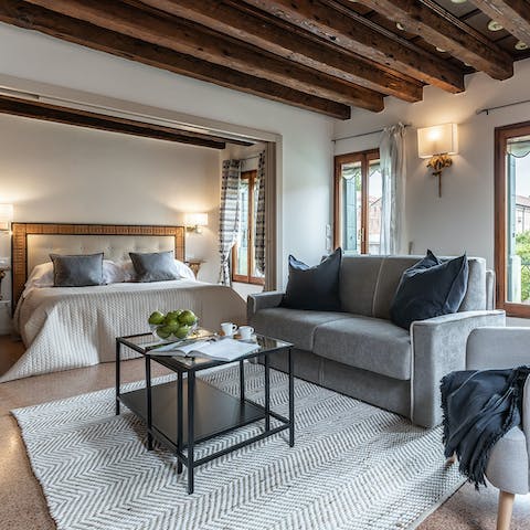 Relax beneath the beams, a glass of Italian wine in hand