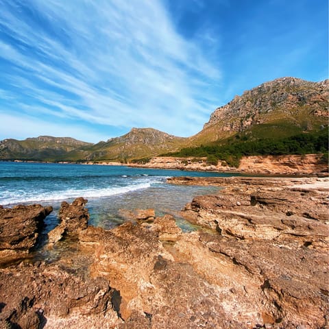 Drive ten minutes to the rocky Mallorcan coast and dip your toes in the waves