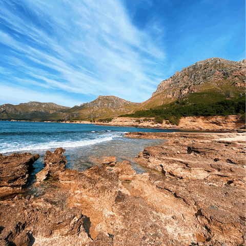Drive ten minutes to the rocky Mallorcan coast and dip your toes in the waves