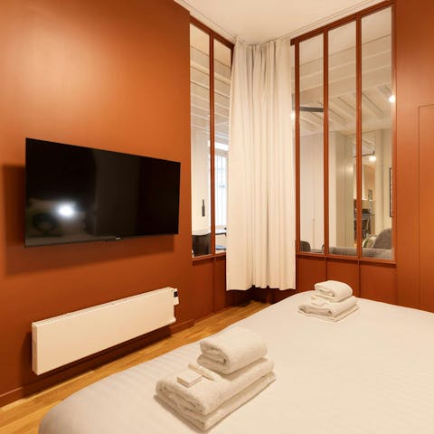 Spend lazy mornings watching TV in bed, from either one of the bedrooms