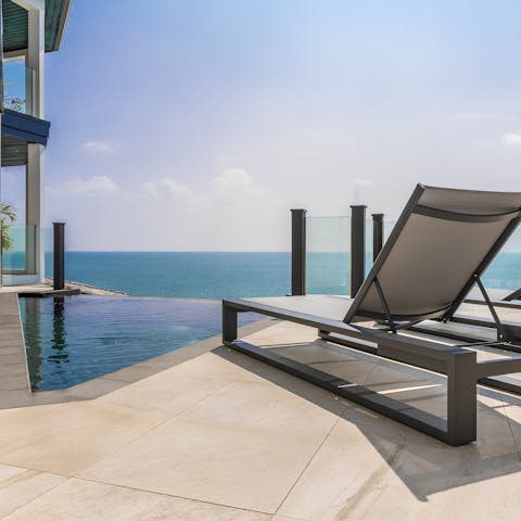 Soak up the sun by your private infinity pool, overlooking the sea