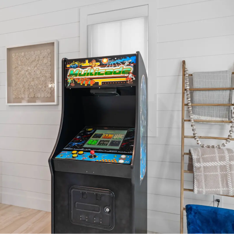 Beat the high score on the arcade game in the games room