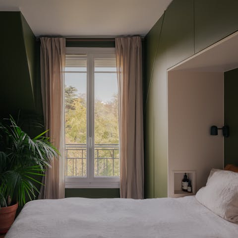 Relax in the serene bedroom after a busy day of sightseeing