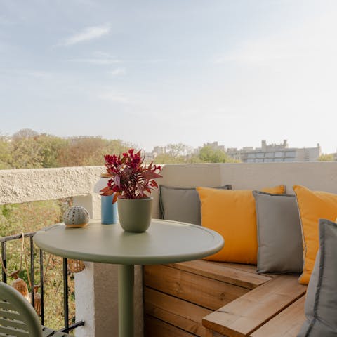 Sip your morning coffee on the private balcony as Paris wakes below