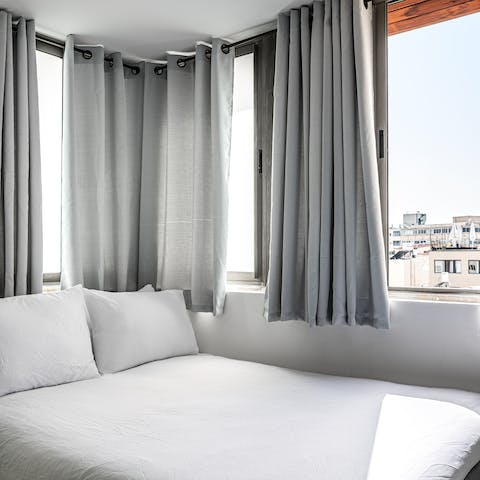 Wake up well-rested in the comfy bed and enjoy lovey city views