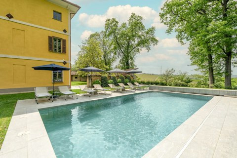 Enjoy the sunshine from the lounger-lined swimming pool