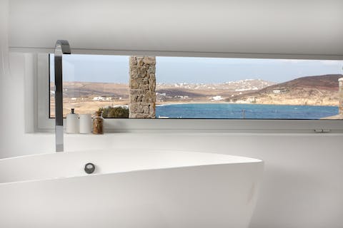 Indulge in a scenic soak in the main bedroom's en-suite tub