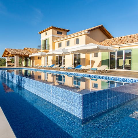Make a splash in the glittering swimming pool on hot afternoons