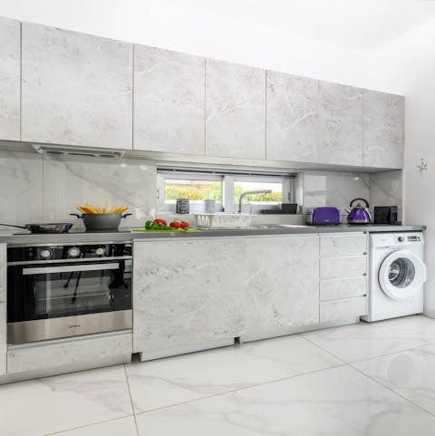 Rustle up a tasty Cypriot breakfast of mpoukkoma in this grey-toned kitchen