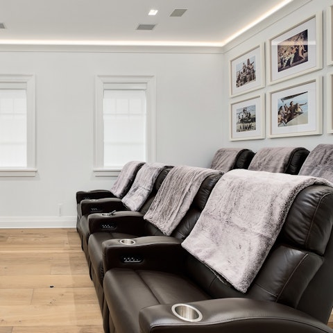 Gather for cosy movie nights in the home cinema