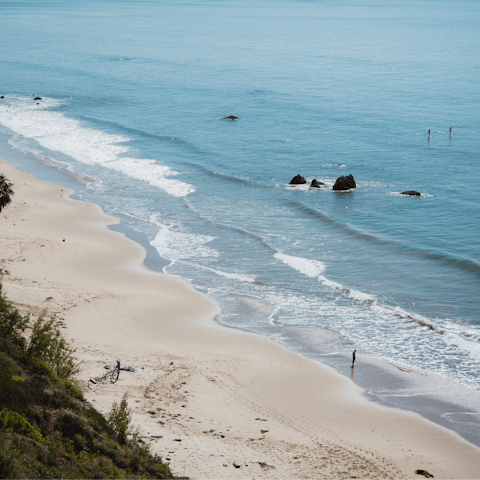 Stay in Malibu Beach and go surfing