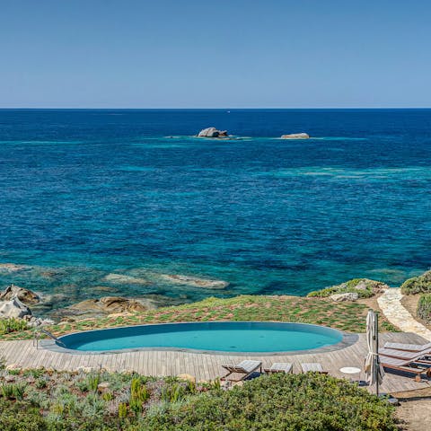 Take a morning dip with the turquoise sea as your backdrop