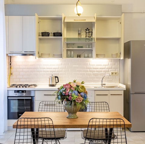 Gather around the chic dining table for relaxed dinners at home