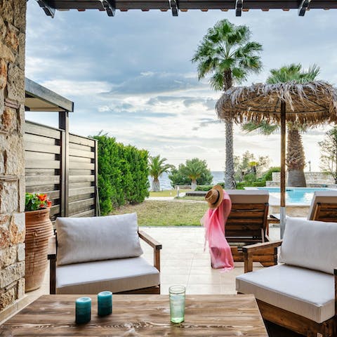 Enjoy a glass of ouzo and listen to the sea just beyond the yard