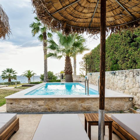 Soak up the sunshine by the private pool