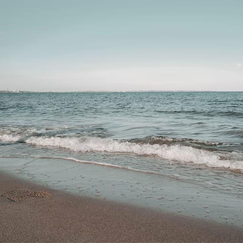 Take the short drive up to Nea Skioni beach and feel the golden sand between your toes