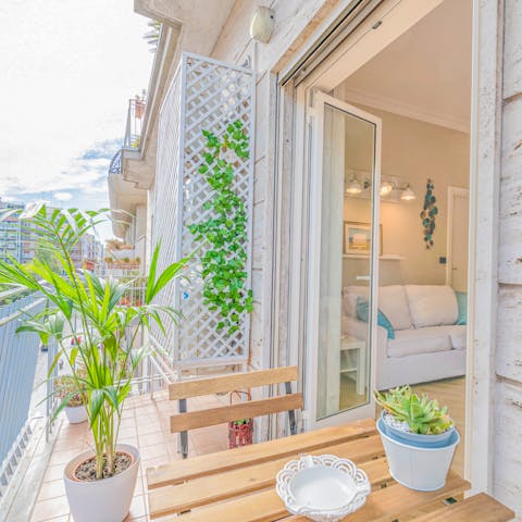 Enjoy coffee or a cocktail on the private balcony