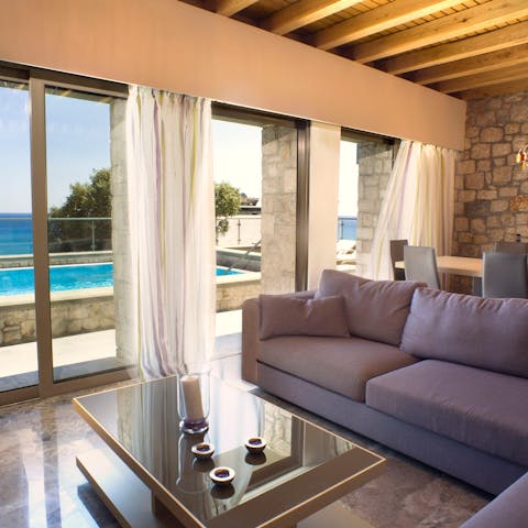 Recline on the sofa and delight in the gentle breeze that drifts through the space