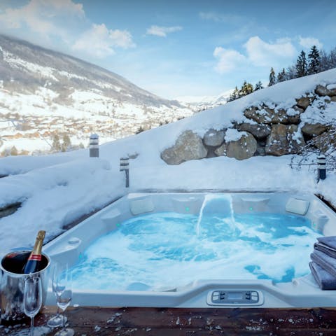 Enjoy a glass of Champagne and the mountain views in the hot tub