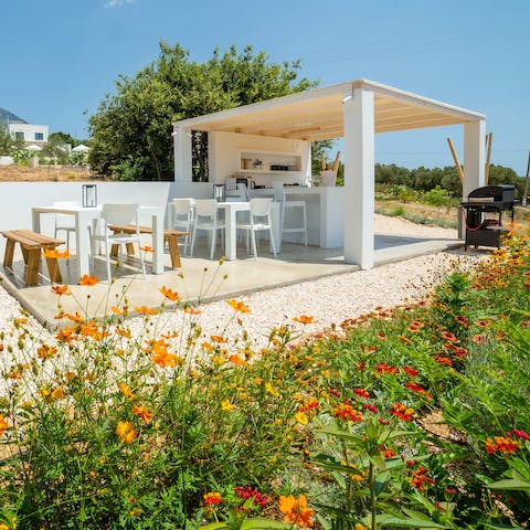 Fire up the barbecue for dinner beneath the stars in the outdoor kitchen