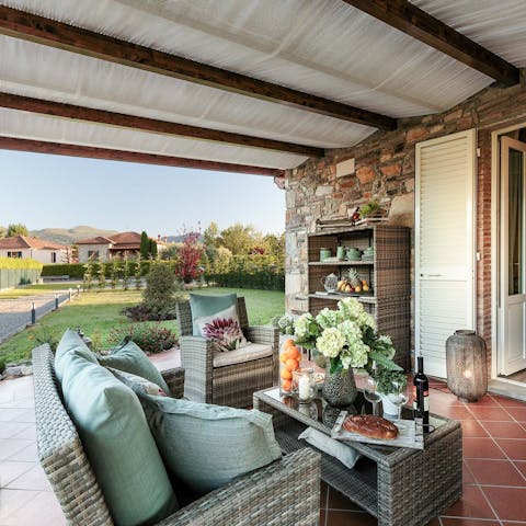 Relax in sunny warmth in the outdoor living area