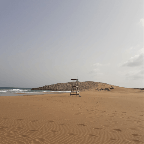 Drive down to Playa del Espalmador and dip your toes into the sea