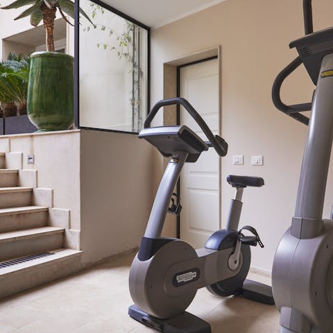 Stay on top of your fitness goals with a workout in the communal gym
