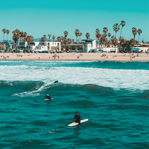 Catch some waves at Mission Beach, a fifteen-minute drive away