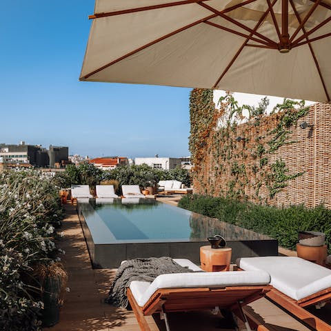 Spend sunny afternoons catching some rays by the communal pool