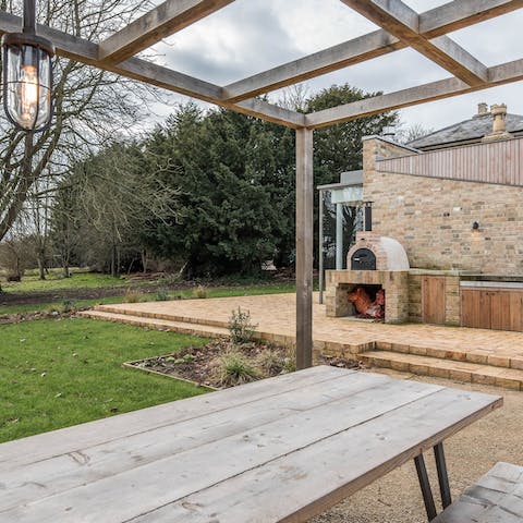 Spill out into the garden for a wood-fired pizza