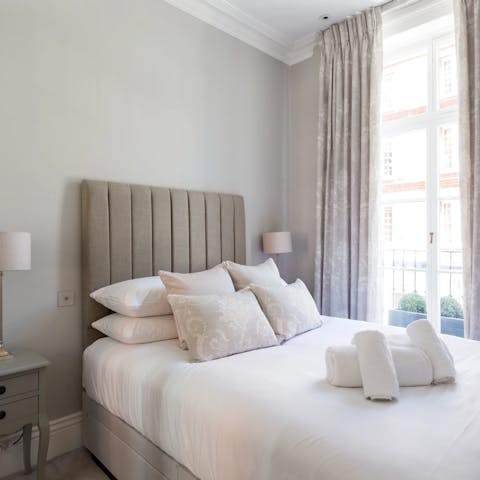 Wake up in the elegant bedroom of this period apartment building 