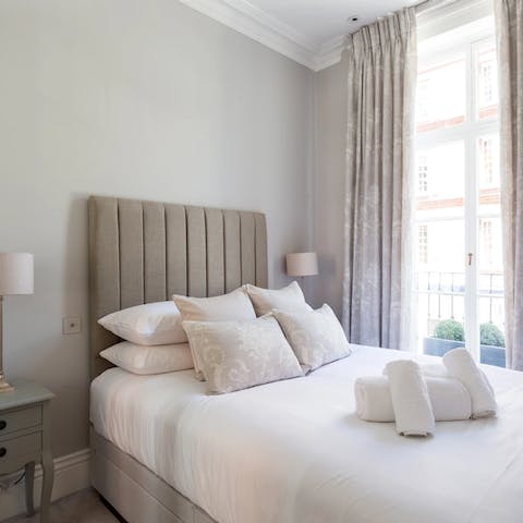 Wake up in the elegant bedroom of this period apartment building