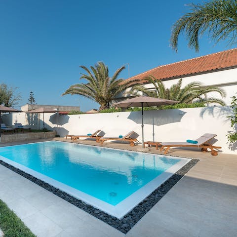 Spend blissful days lounging by the pool, soaking up the sun, and catching up on your current read