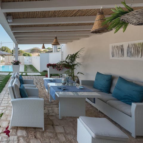Settle into the outdoor sofa set for a few glasses of wine after a dinner, enjoying light-hearted conversation