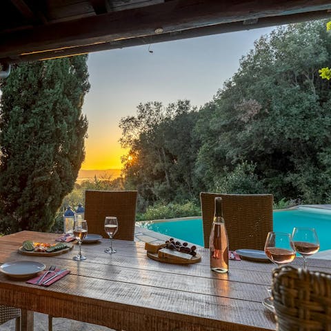 Drink in the sunset over dinner and wine on the terrace