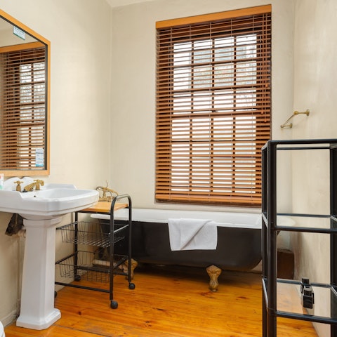 Run yourself a piping hot bath in the cast-iron clawfoot tub