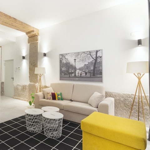 Pour a cold glass of wine and unwind on the sofas for a recap of the day