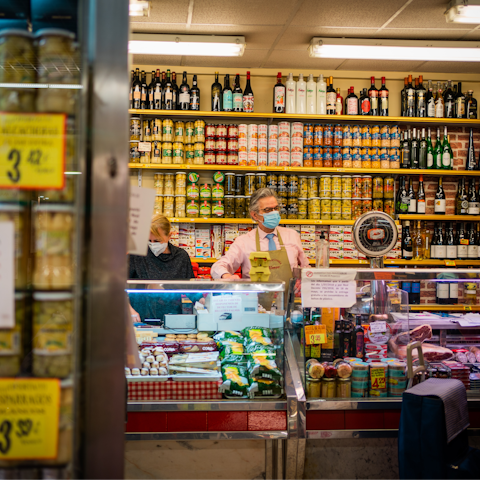 Visit the vibrant indoor market, Mercado Antón Martín, a short walk away