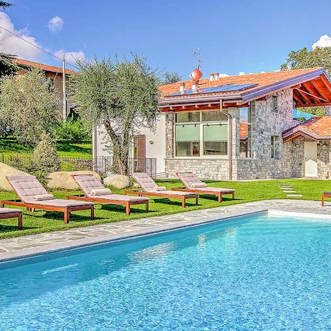 Spend dreamy days relaxing by the pool, reading your book, and taking dips to cool off