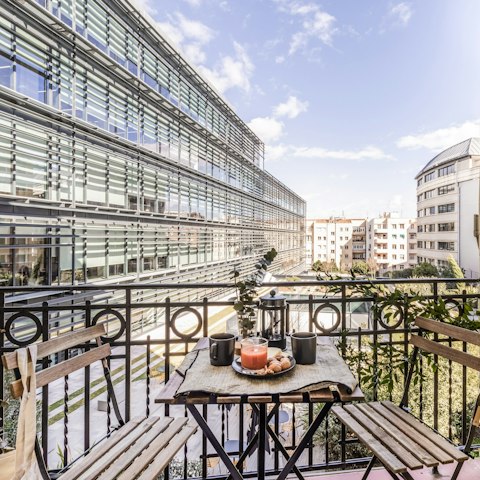 Sip your morning coffee on the balcony while you plan your day in Madrid