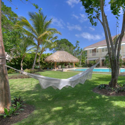 Feel the warm Caribbean breeze as you sway in the hammock
