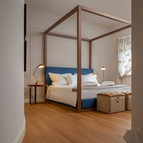 Sink into your magnificent four-poster bed