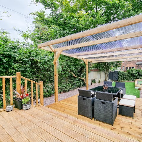 Take full advantage of the covered terrace and the beautiful gardens beyond