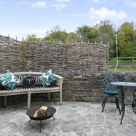 Light up the firepit on the terrace and stare up at the starry night sky