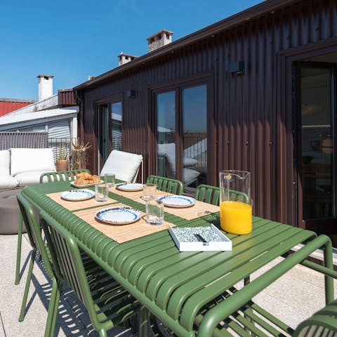Feast on Piri-Piri chicken on the alfresco dining set out on the terrace