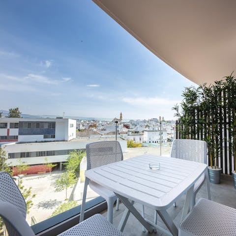 Gaze out over the rooftops of Estepona from the private balcony