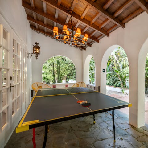 Play a game of outdoor ping pong